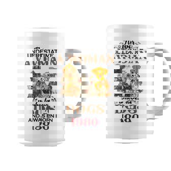 1980 A Woman Who Loves Dogs Coffee Mug | Mazezy