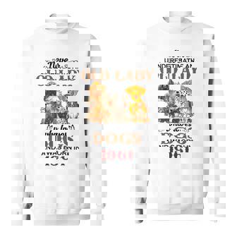 1961 An Old Lady Who Loves Dogs Sweatshirt | Mazezy