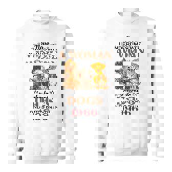 1966 A Woman Who Loves Dogs Sweatshirt | Mazezy