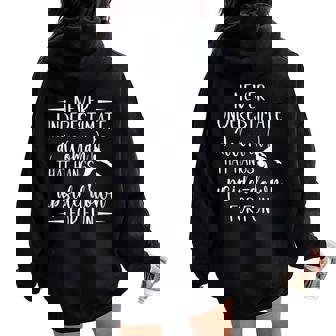 Never Underestimate A Woman That Hangs Upside-Down Lyra Women Oversized Hoodie Back Print - Monsterry