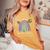 Autism In April We Wear Blue Autism Rainbow Awareness Month Camiseta extragrande cómoda para mujer Mustard