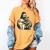Jesus Hugging Raccoon - Vintage Women's Comfort Colors T-Shirt Mustard