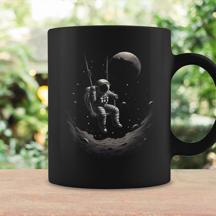 Astronaut Sitting On A Swing In Space Stars Moon Tassen Geschenkideen