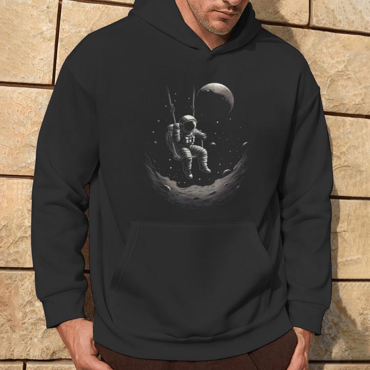 Astronaut Sitting On A Swing In Space Stars Moon Kapuzenpullover Lebensstil