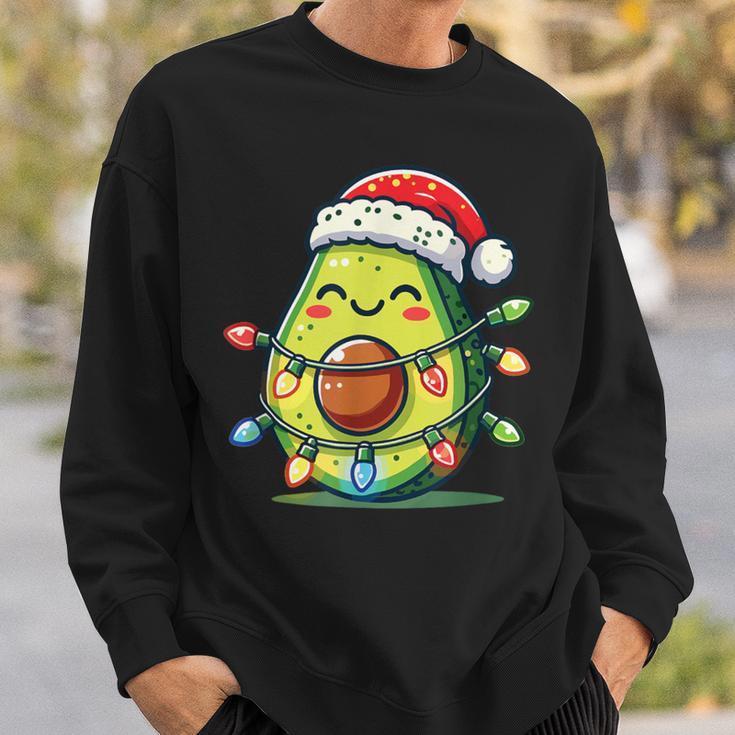 Festive Avocado Santa Christmas Lighting Sweatshirt Geschenke für Ihn