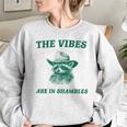The Vibes Are In Shambles Sarcastic Raccoon Cowboy Women's Oversized Sweatshirt Sport Grey
