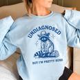 Cowboy Raccoon Meme Women's Oversized Sweatshirt | Fun & Cozy Vibe Light Blue