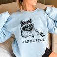 A Little Feral Raccoon With Moon Animal Raccoon Trash Panda Women's Oversized Sweatshirt Light Blue