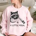 A Little Feral Raccoon With Moon Animal Raccoon Trash Panda Women's Oversized Sweatshirt Light Pink