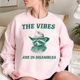 The Vibes Are In Shambles Sarcastic Raccoon Cowboy Women's Oversized Sweatshirt Light Pink