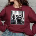 Scared Raccoon Selfie Women's Oversized Sweatshirt - Fun Bigfoot Theme Maroon