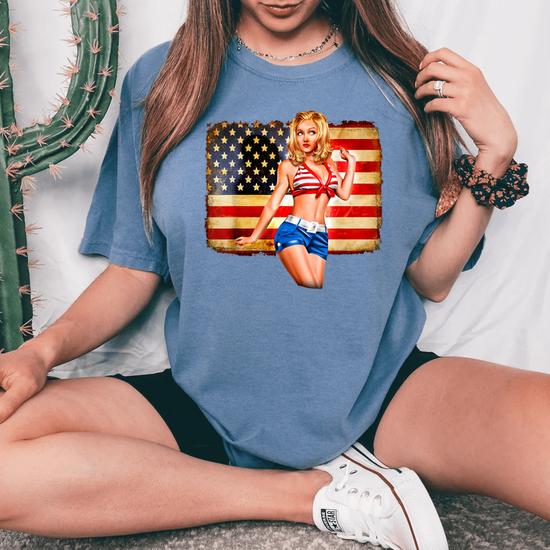 Sexy Blonde Woman Shorts Bra American Flag Tee 4th Of July Women's Oversized Comfort Colors T-Shirt | Monsterry Sexy Blonde Woman Shorts Bra American Flag Tee 4th Of July Women's Oversized Comfort Colors T-Shirt | Monsterry